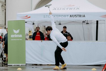 A white, printed folding gazebo from Ecotent's E2 series measuring 4.5 x 3 metres with side walls is used at a sports event organised by Stocksport Austria.